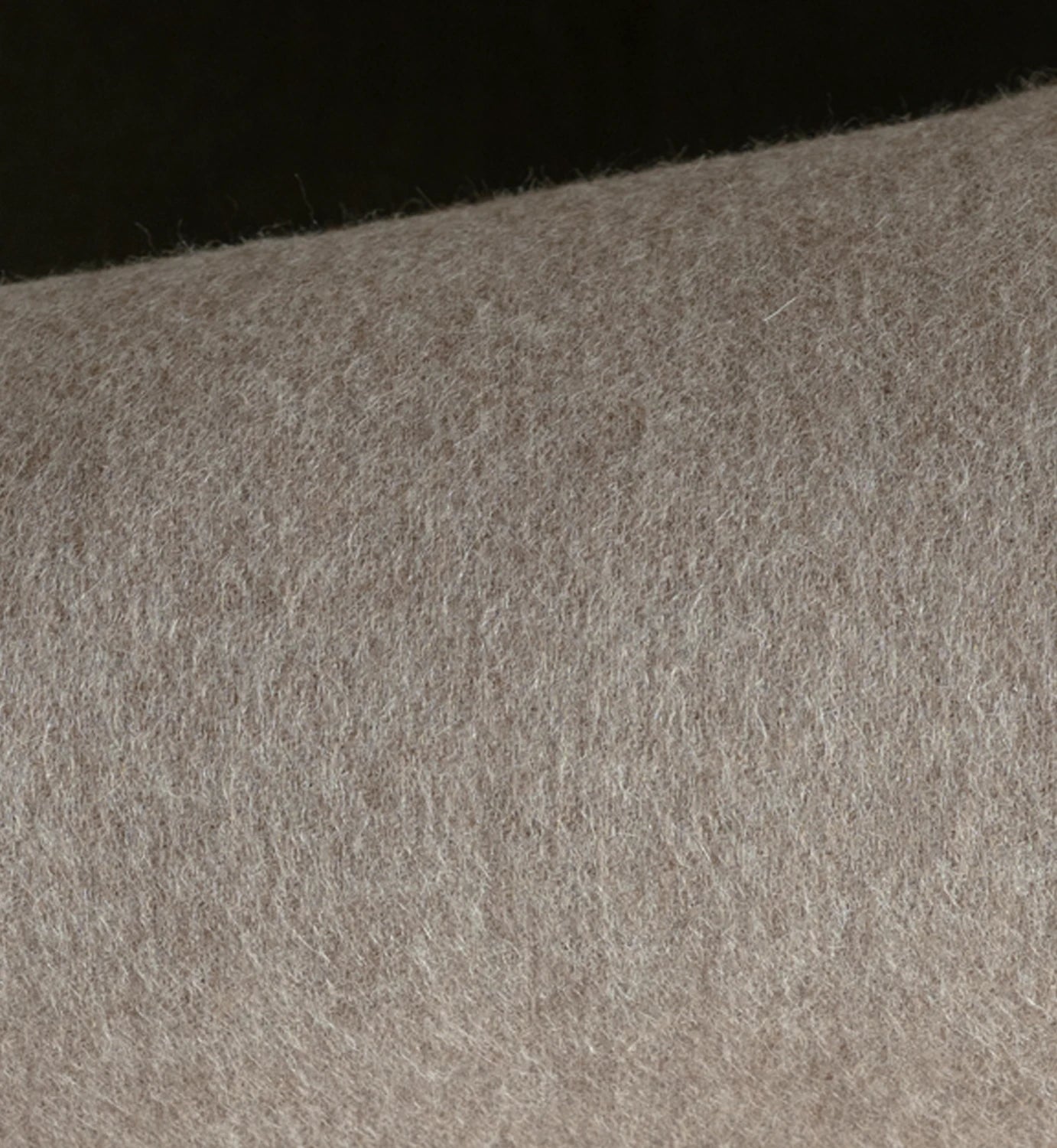 Close-up of gray fabric texture on a black background