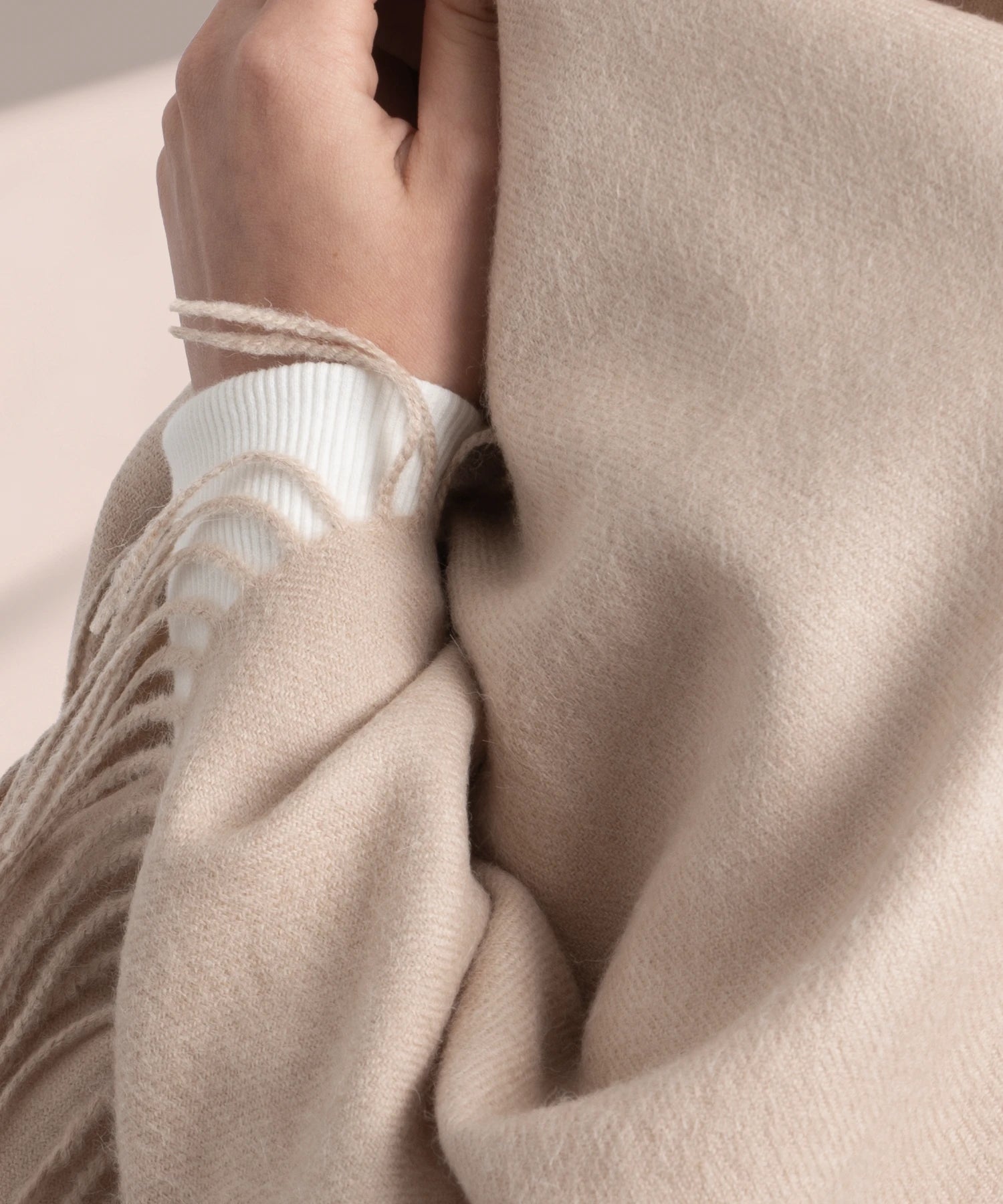Close-up of a beige sweater with a soft texture