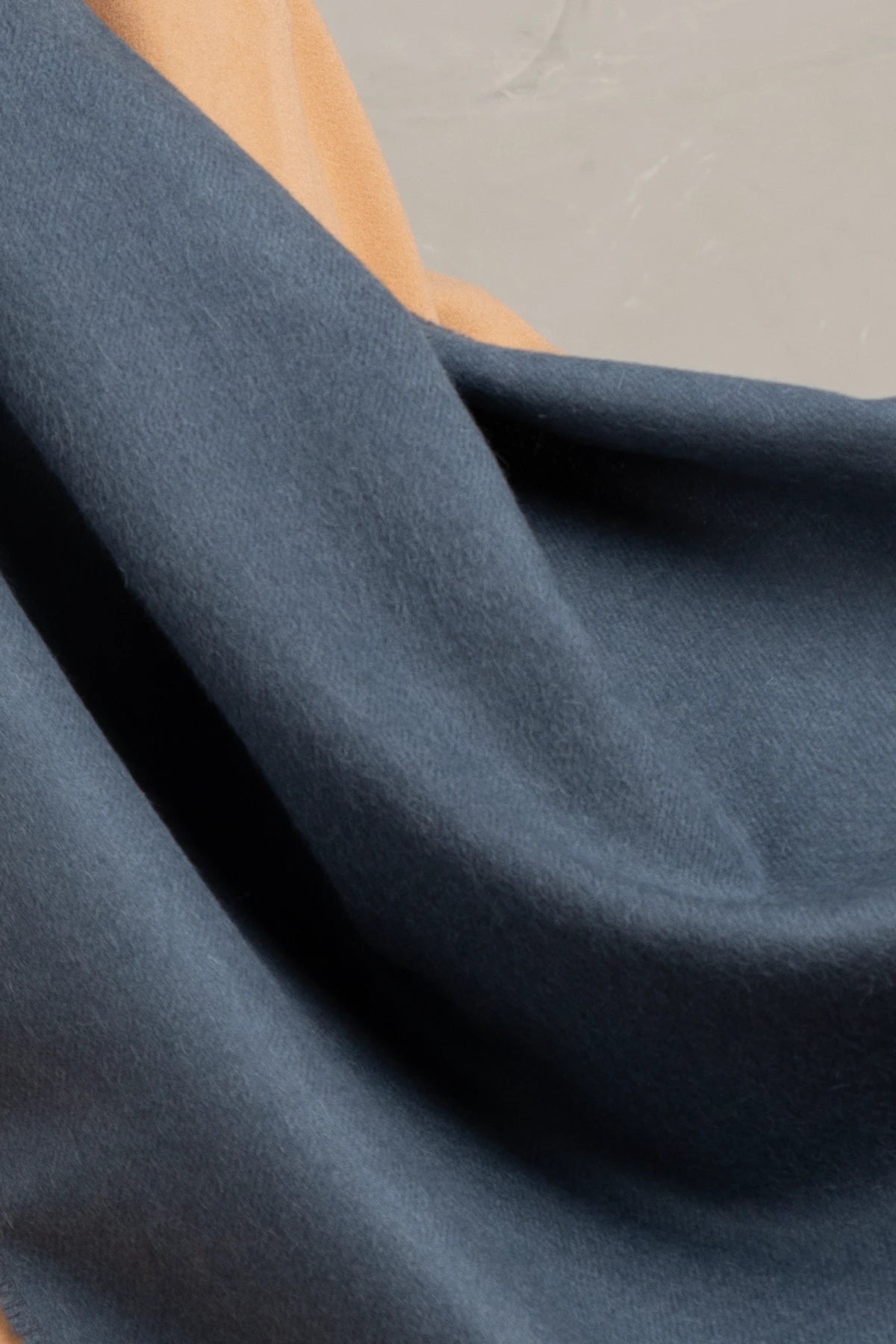 Close-up of blue fabric with a blurred background
