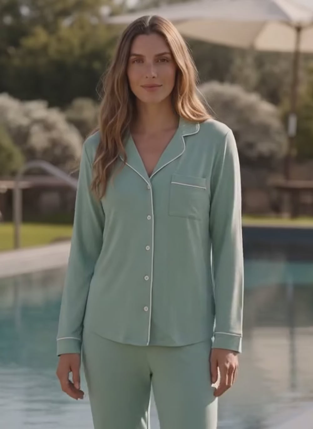 a women using a pyjama by the pool 