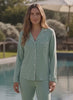 a women using a pyjama by the pool 